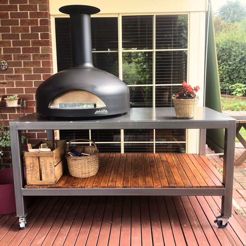 Polito Giotto Wood Fired Oven sitting on stainless steel table with wheels