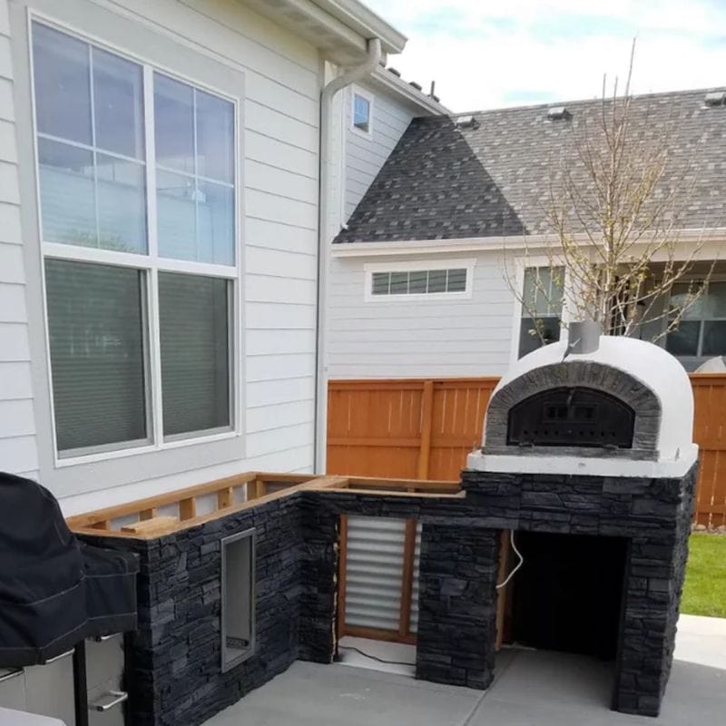 Buena Ventura Premium Pizza Oven on a black countertop outdoor kitchen