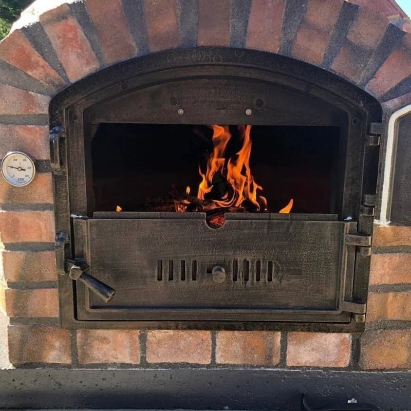 Half open door of the Lisboa Brick Wood Fired Oven