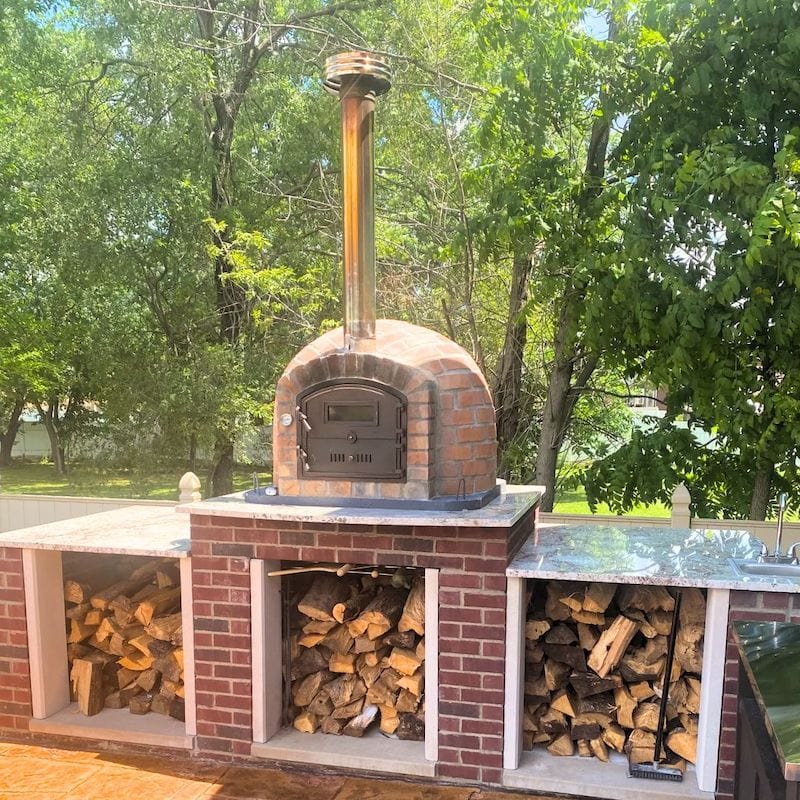 Lisboa Rustic Brick Finish Premium Pizza oven in an outdoor kitchen