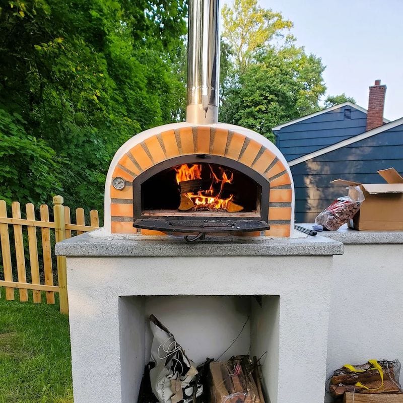 Wood burning inside the Pizzaioli Premium Brick Wood Fired Pizza Oven 