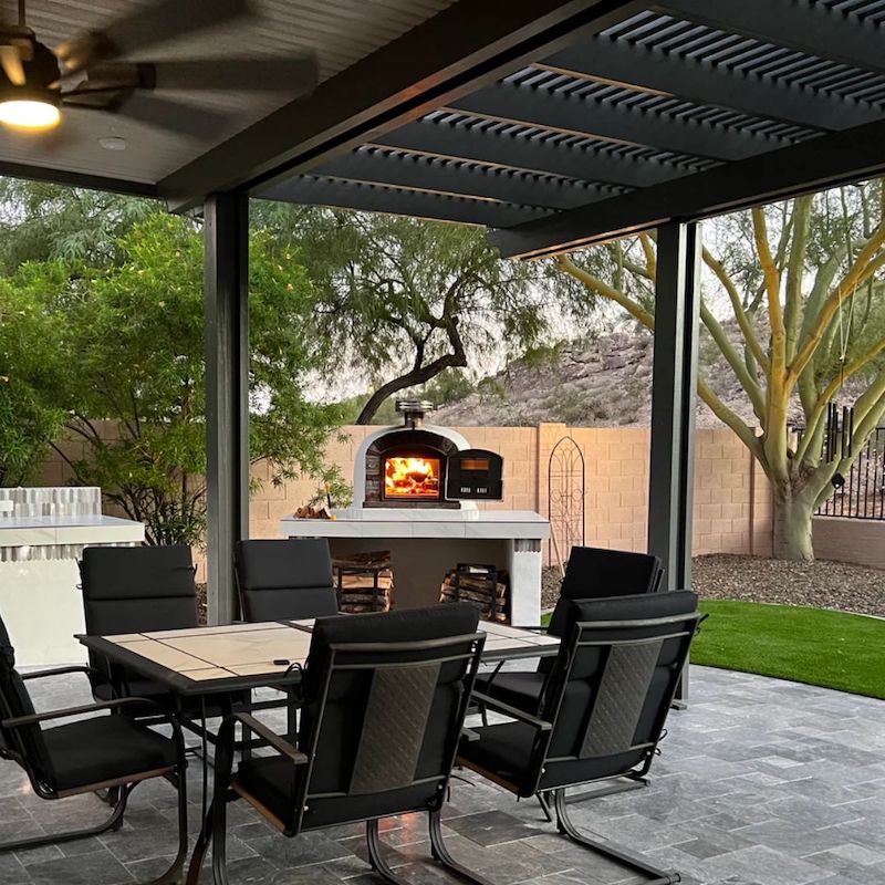 Ventura Preto Brick Pizza Oven displayed in an Outdoor Entertainment Area