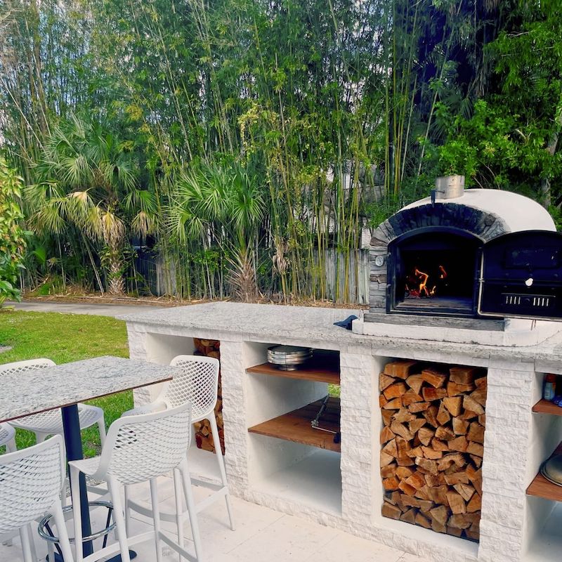 Ventura Preto Brick Pizza Oven on an outdoor kitchen countertop