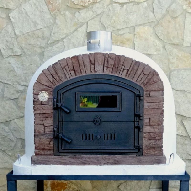 A close up of the Ventura Sierra Wood Fired Brick Oven with sandy red tone arch